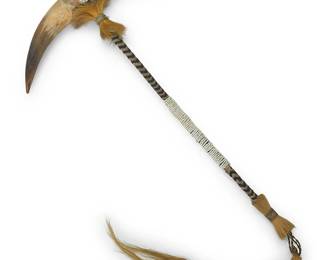 3276
A Sioux dance wand
Early 20th century; Great Plains
A dance wand or club with double horn end with applied beaded hide accents, attached to a braided horsehair shaft with white bead accents, and with a horse hair fringe "tail"
19" H x 12" W; Fringe: 12" L
Estimate: $200 - $400