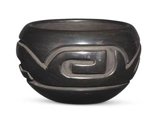 3307
Stella Chavarria (b. 1939, Santa Clara Pueblo)
A blackware pottery bowl, mid/late 20th century
Incised to underside: Stella Chavarria / Santa Clara Pueblo
Deeply carved with a band of geometric motifs
3.25" H x 5.375" Dia.
Estimate: $200 - $300