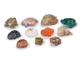 3408
A group of Southwest Pueblo carved stone frog fetish figures
Mid/late 20th century, mostly Zuni Pueblo
Two labeled for artist
Comprising eleven frog fetish figures in various stones including malachite, various green stones, and shell, and in various sizes, including two figures by Zuni artists including Laura Quam, and Fabian Tsethlikai, as well as nine further frog figures, many with inset turquoise accents and one with a mounted offering
11 pieces
Largest: 0.5" H x 2" W x 2.25" D; Smallest: 0.75" H x 1.25" W x 1.5" D
Estimate: $200 - $400