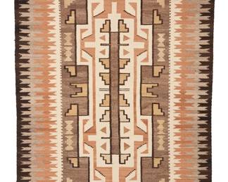 3231
A Navajo Two Grey Hills rug
Mid-20th century, Diné
With two stacked elaborate stepped diamonds within an intricate long edge border, woven in dark brown, natural grey, ochre, tan, cream, and natural brown wool
99.5" H x 53.5" W
Estimate: $1,000 - $1,500
