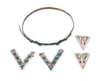 3391
A group of Southwest sterling silver and turquoise dress items
Late 20th century
Two marked for maker and for sterling
Three works comprising an adjustable Ivan Howard Navajo/Diné sterling silver hat band with row-set turquoise and two buckles, as well as two sets of silver collar points, including a pair of Oscar Alexius Navajo/Diné sterling silver collar points with silver overlay and set nugget turquoise, and a pair of chased silver openwork points
5 pieces
Hat band: 25" to 22" Dia. x 0.625" H; Points: 3.5" H x 3" W & 2.25" H x 2" W
147.9 grams gross
Estimate: $200 - $400