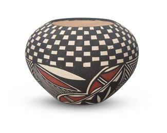 3353
An Acoma Pueblo polychrome pottery jar
Late 20th/early 21st century
Signed to underside: TL
With black and red fine-line motifs throughout on a white slip ground
3.125" H x 4.5" Dia.
Estimate: $100 - $200