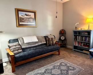 In new condition day bed, small bookcase 