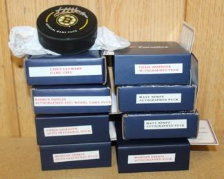 signed hockey pucks