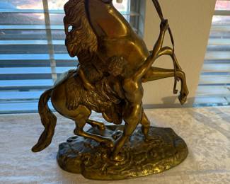 brass horse and rider figure