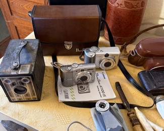 vintage cameras, binoculars, pipe
