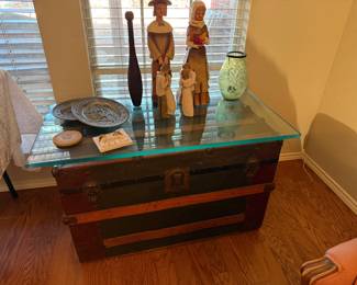 antique trunk with glass top to serve as coffee or side table