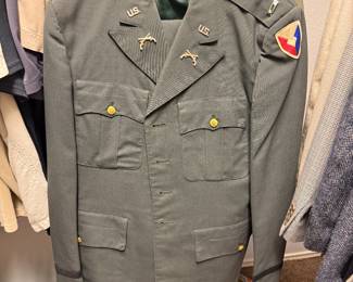 Vintage U.S. Army uniform coat, likely from the Vietnam War era, with insignia for the 3rd Armored Division, also known as "Spearhead" or "Third Herd". 