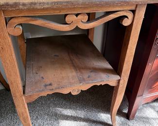 antique carved side table with under shelf