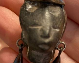 Vintage Taxco Mexico sterling silver brooch or pendant featuring a face with an amethyst stone