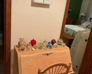 Secretary and chair. Variety of paperweights.