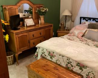Antique piece, cedar chest, full sized bed 2 night stands, 2 lamps, flower arrangements.