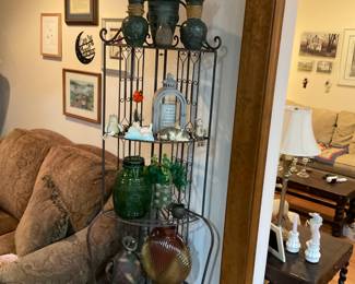 Display shelf with interesting vases and pottery.
