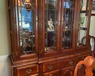 lighted display case with drawers and storage below