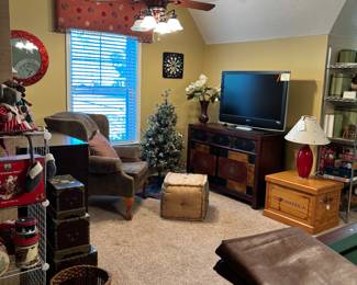 lamps, wing back chair, stackable décor boxes, dresser cabinet, storage table round mirror TV