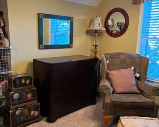 Black wooden accent chest, mirror with sunflowers, stackable boxes, round mirror , lamp small, tall accent table