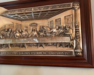 a metallic relief sculpture of The Last Supper