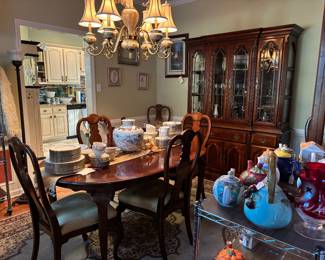 dining room table with chairs   Display case with drawers and storage   
