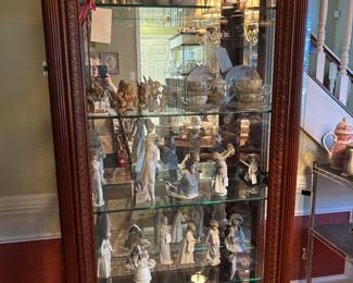 lighted display cabinet collection of Lladro porcelain figurine