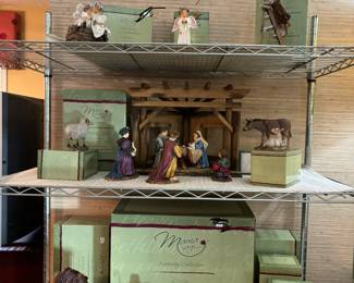 Demdaco Mama Says Nativity collection by artist Kathy Andrews Fincher. The collection features various hand-painted resin figurines that depict the traditional Christmas nativity scene