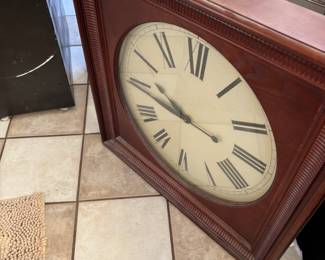 large wooden wall clock