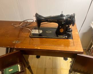 Singer, sewing machine. Comes with original book.