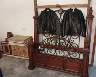 leather jackets, low cabinet, King size wood and and iron bed