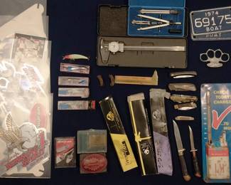 boat license plates, Rapala lures, Snap On swag, L&M cigarette tin sign, thermometer, pocket knives