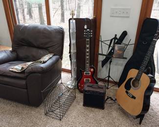 leather recliner, Keith Urban electric guitar set, Burswood acoustic guitar and case, music stand