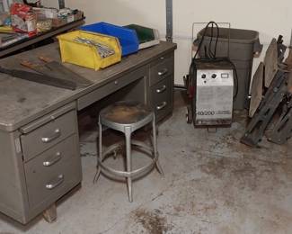 metal desk, stool, battery charger