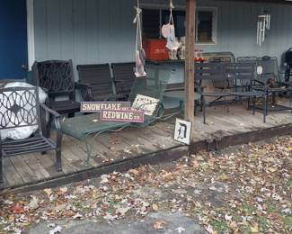 Woodard outdoor chairs, small electric smoker, Traeger smoker, patio chairs, tables, benches, barrels, shepherd hooks