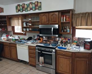 LG propane stove, LG over the oven microwave, GE dishwasher, Pioneer Woman cookware