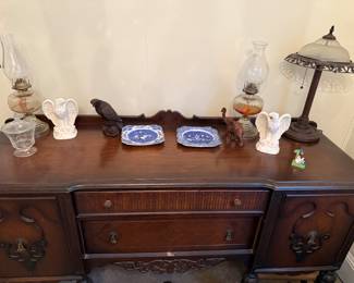 Vintage Wallace Furniture Company dark wood buffet with ornate carvings and brass hardware.