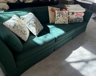Green linen couch, vintage quilts