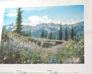 This print shows a photo of Mt. Rainier in Washington State. It was produced by the Standard Oil Company to encourage car trips to scenic places.