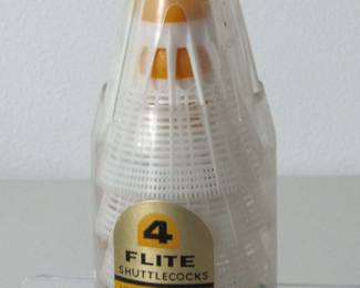 These four shuttlecocks, also known as badminton birdies, come in their original packaging, although one of the four is a different type. They have rubber tips.