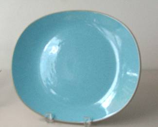 This 11-inch Harkerware serving platter is speckled and the color is blue mist. It was made in the 1950s-1960s. The company closed in 1972.
