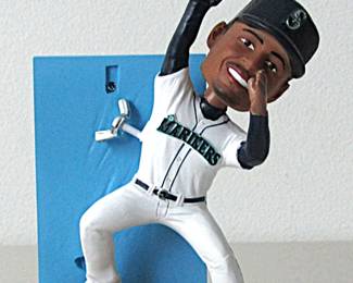 This Ken Griffey Jr. Home Run Robbery Bobblehead is new in the box. All you need to do is attach him to the stand. It commemorates a great play made by Griffey on May 5, 1996. It was a promotional giveaway item at a Seattle Mariners game on April 15, 2024.