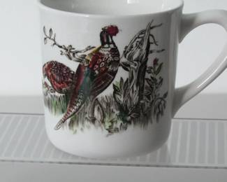 These four Johnson Bros. ceramic mugs feature pheasants, often called game birds, and date from about 1940 to 1960. They feature an embossed mark on the bottoms that says Made in England.