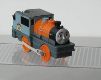 Dash train engine. Battery operated. Part of the Thomas the Tank Engine playset. TOMY Plarail from the 1990s. Can pull other train cars in the set. See other lots for other train cars.