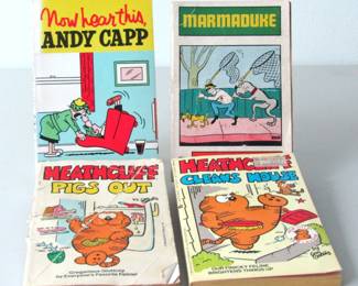 Four cartoon books: Andy Capp, Marmaduke, and Heathcliff
