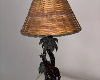 There are two of these cool lamps with giraffes and trees