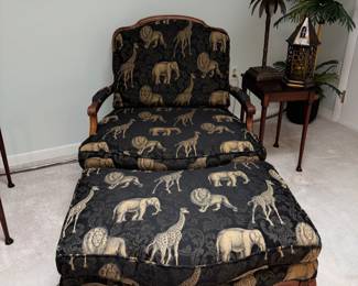 Black and gold embroidered Safari, animals, armchair, and matching ottoman.