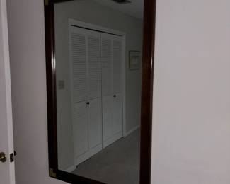 Large campaign style mirror with brass hardware