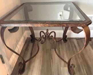 BUY IT NOW! $125.00.  Glass top table with iron base.  27" W x 27" D x 25" H.