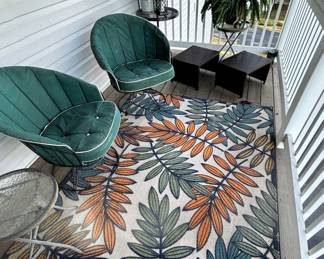 Variety of patio/deck furniture and rug.