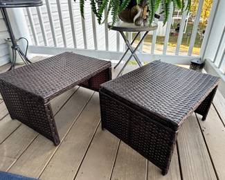 Pair of brown wicker rattan outdoor side tables.