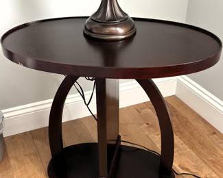 Dark wood oval side table. 25" W x 15" D x 22" H.