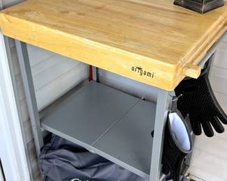 Origami foldable wheeled portable solid wood top kitchen island.