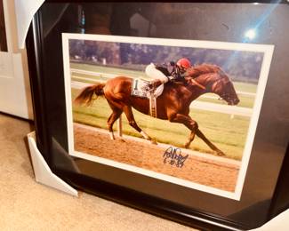 Racing photos signed by jockeys 